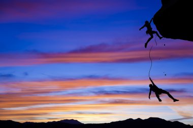 Team of climbers in danger. clipart