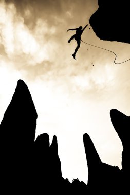 Rock climber falling. clipart