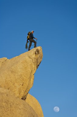 Climber on the summit. clipart