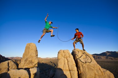 Team of climbers on the summit. clipart