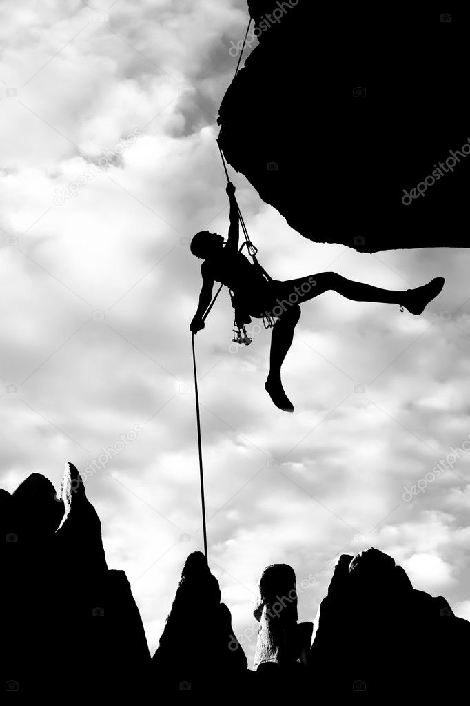 Climber dangling from a rope.