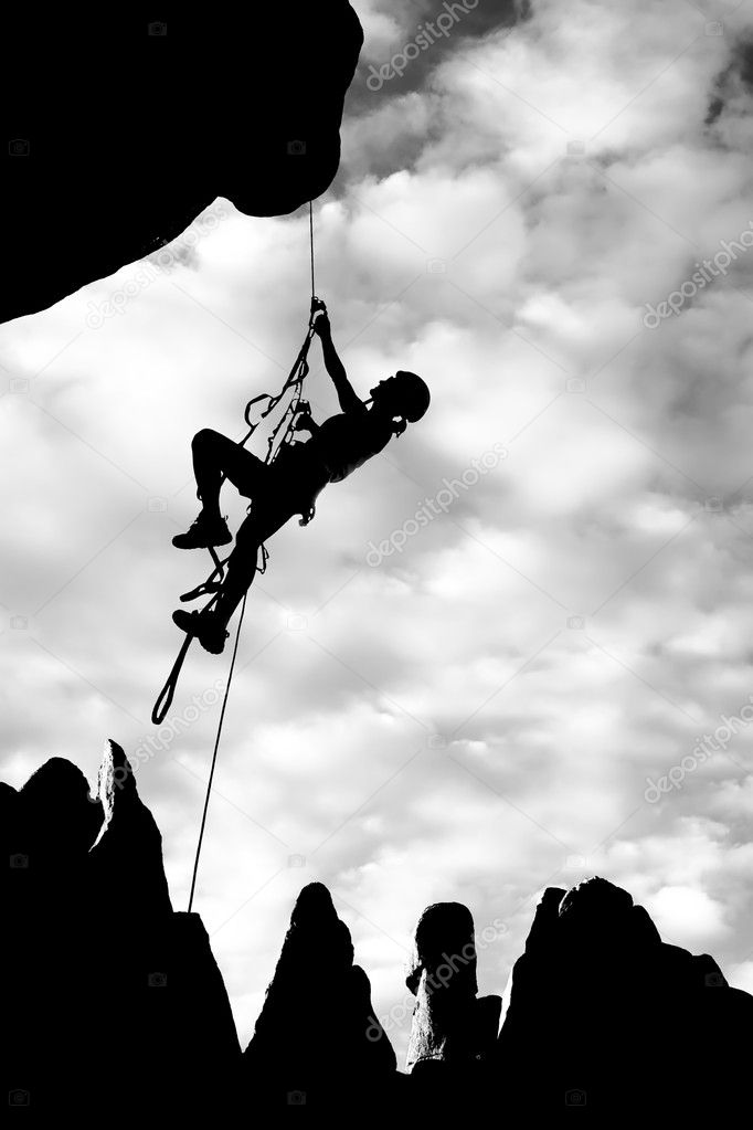 Climber dangling from a rope.