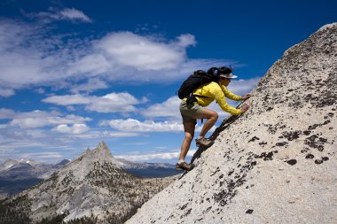Rock climber on the summit. clipart