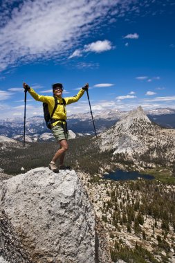 Rock climber on the summit. clipart