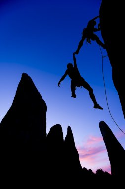 Team of climbers in danger. clipart