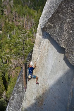 Climber ascending a difficult crack. clipart