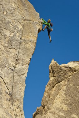 Female rock climber. clipart