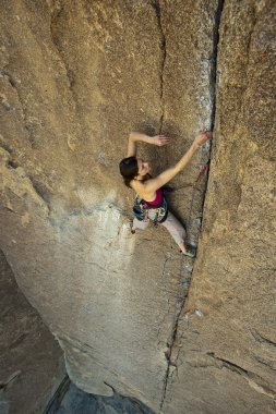 Female rock climber. clipart