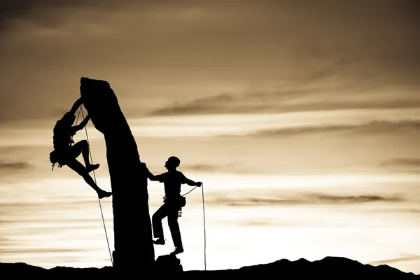 stock image Team of climbers reaching the summit.