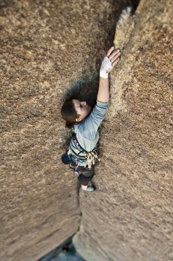 Female rock climber at Joshua Tree National Park, CA. clipart