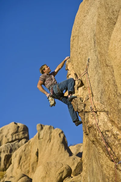 Rock climber dangling. Royalty Free Stock Images