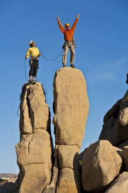 Team of rock climbers. clipart