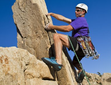 Male rock climber. clipart