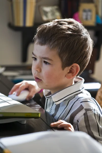 Young boy working on computer. — Stock Photo, Image