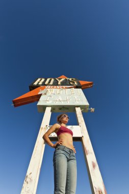 Young woman posing at rest stop. clipart