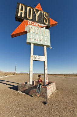 Young woman posing at rest stop. clipart