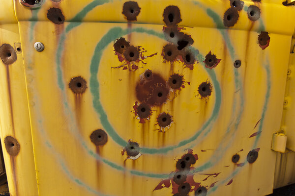 Bullet holes in old truck.