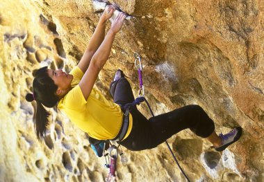 Female rock climber. clipart