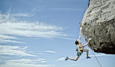 Female rock climber. clipart