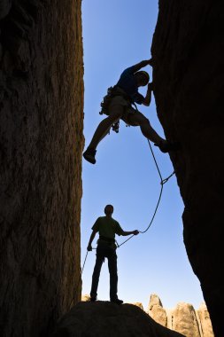 Team of rock climbers. clipart