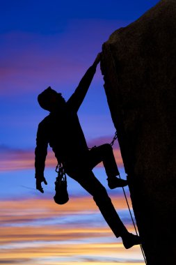 Climber going for the summit. clipart