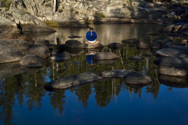 Hiker pausing for a moment of contemplation. clipart