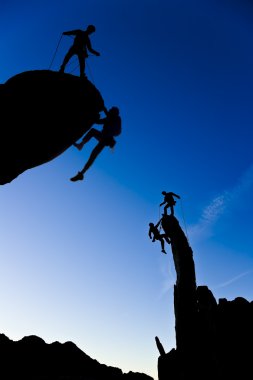 Team of climbers on the summit. clipart