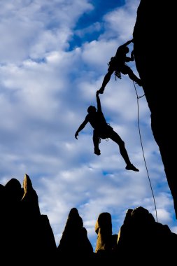 Team of climbers in danger. clipart