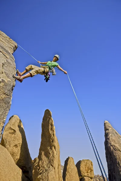 Rock climber rappelling. — Stock Photo, Image