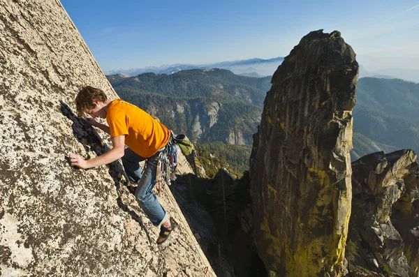 Rock climber reaching. — Stock Photo, Image