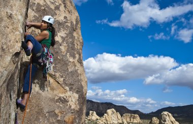 Female rock climber. clipart