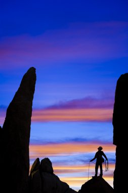 Rock climber nearing the summit. clipart