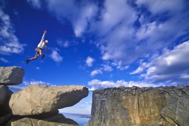 Rock climber on the summit. clipart