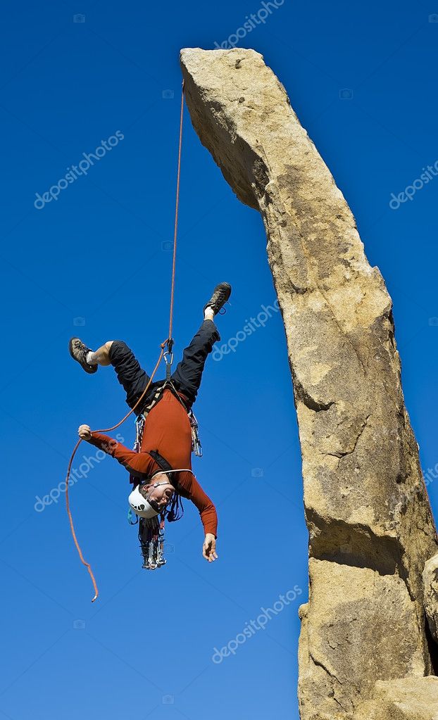 Rock climber rappelling. — Stock Photo © gregepperson 6422902