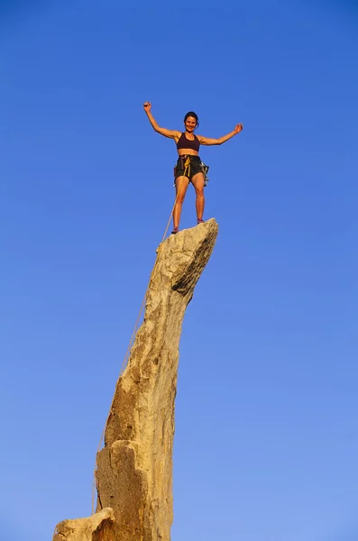 Rock climber reaching the summit. — Stock Photo, Image