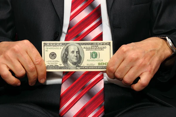 Podnikatel drží sto dolar — Stock fotografie