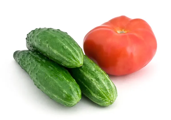 Stock image Three cucumbers and tomato