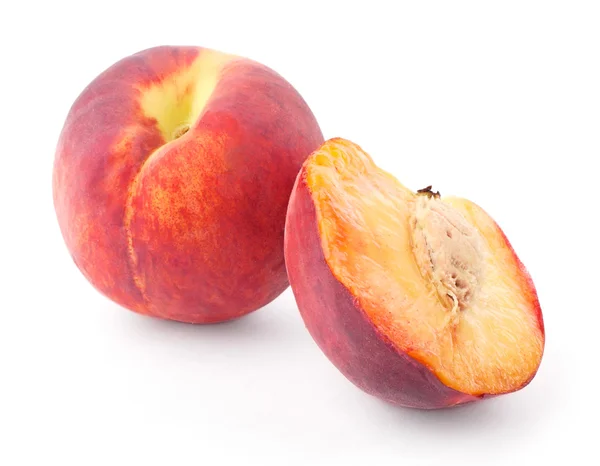 Персик с половиной — стоковое фото