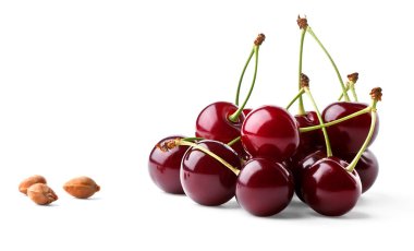 Juicy ripe cherries and cherrystones clipart