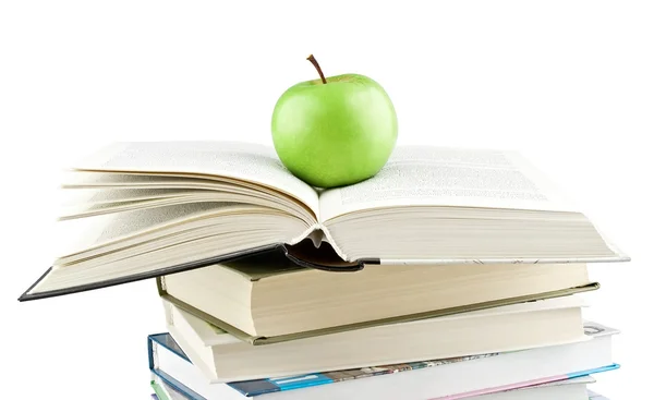 Groene appel op het uitgebreide leerboek — Stockfoto