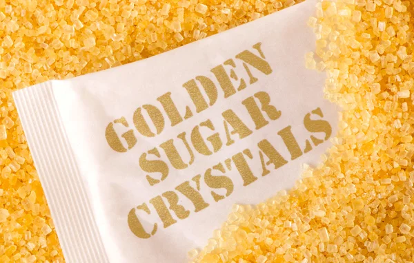 Золотые кристаллы сахара — стоковое фото