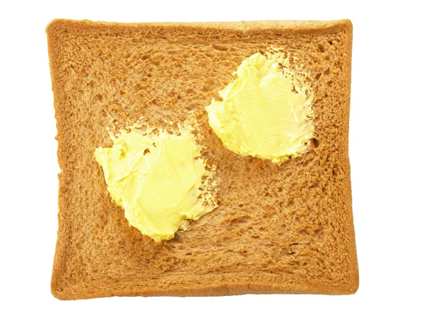 Pan rebanado con mantequilla — Foto de Stock