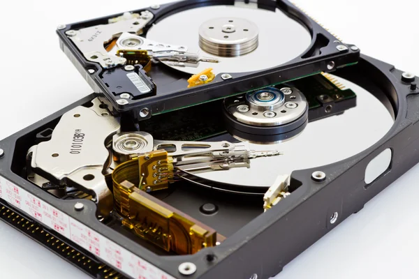 Detail comparison of an open 2.5 and 3.5 disk drive — Stock Photo, Image