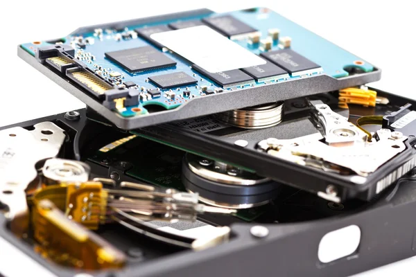 Detail comparison of an open 2.5 disk drive, 3.5 disk drive an — Stock Photo, Image