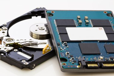 SSD vs HDD, new vs old, new technology with no mechanical elemen clipart