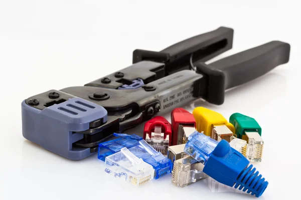 Cat5 cable jacks and crimping tool — Stock Photo, Image