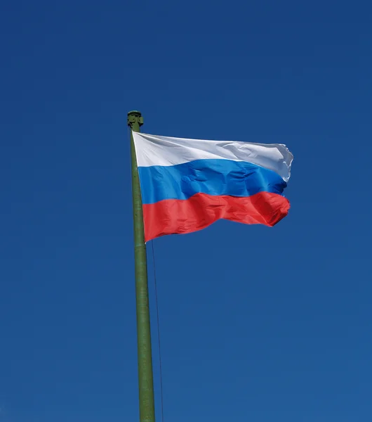 Flag of Russia against the blue sky — Stock Photo, Image