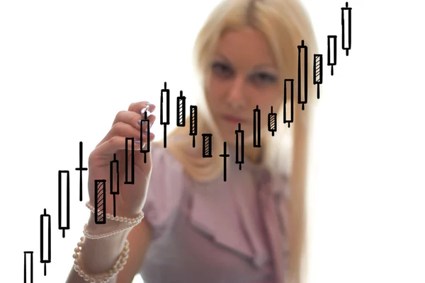 The businesswoman writes the grath on the glass Stock Image
