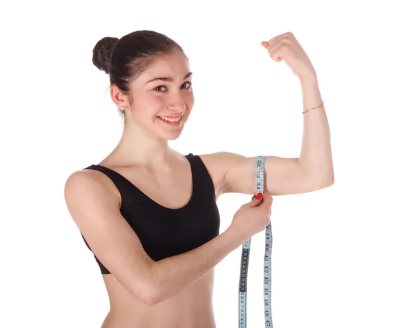Fitness woman measuring her arm — Stock Photo, Image
