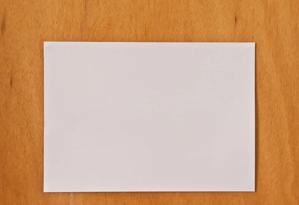 stock image New blank paper page on wood background horizontal